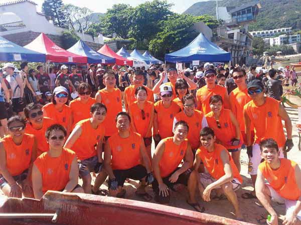 Staff taking part in the Dragon Boat races