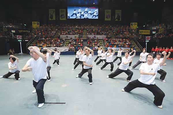 Staff participating in the “Lifeline Express Kung Fu for Brightness 2013” charity performance in July 2013