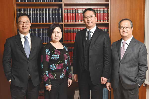 The Secretary for Justice with staff members of the Secretary for Justice’s Office (from left): Administrative Assistant to Secretary for Justice, Mr Howard Lee; Senior Personal Assistant to Secretary for Justice, Miss Polly To; Secretary for Justice, Mr Rimsky Yuen, SC; and Press Secretary to Secretary for Justice, Mr Terence Yu