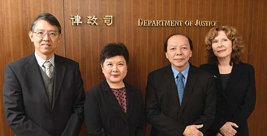 Solicitor General, Mr Frank Poon (second right), with his deputies (from left): Deputy Solicitor General (General), Mr Peter Wong; Deputy Solicitor General (Constitutional), Ms Roxana Cheng; and Secretary of the Law Reform Commission, Ms Michelle Ainsworth