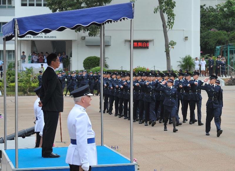 Mr Yuen inspects a passing-out parade at the Hong Kong Police College.