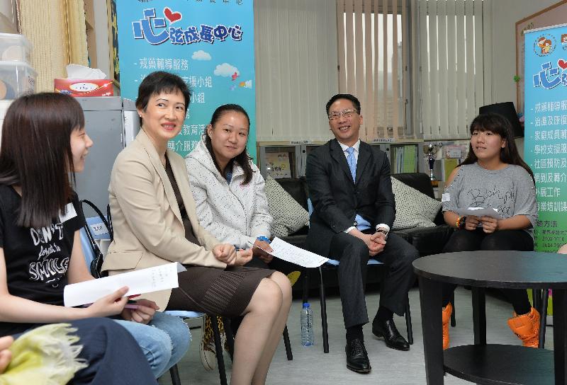 Mr Yuen (second right) chats with voluntary workers and youth members of the Sane Centre of the Hong Kong Children & Youth Services.