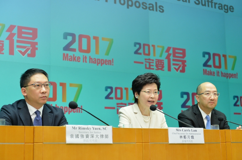 The Chief Secretary for Administration, Mrs Carrie Lam (centre) speaks at the press conference.