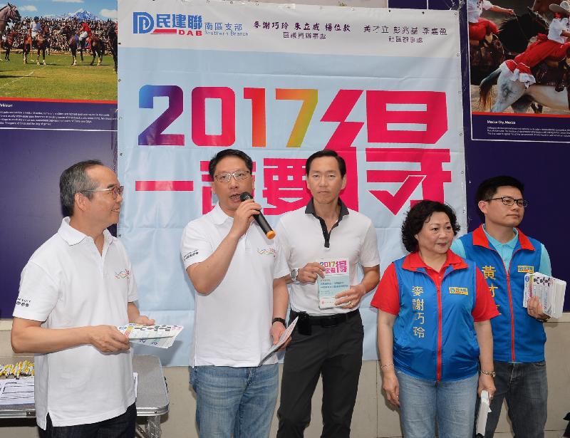 The Secretary for Justice, Mr Rimsky Yuen, SC (second left), together with Member of the Executive Council Mr Bernard Chan (third left) and the Under Secretary for Constitutional and Mainland Affairs, Mr Lau Kong-wah (first left), reached out to the public in Aberdeen this morning (May 3). Photo shows them distributing "2017: Make it happen!" leaflets to members of the public in Aberdeen and calling for their support to urge the Legislative Council to endorse the Government's proposals for selecting the Chief Executive by universal suffrage in 2017.