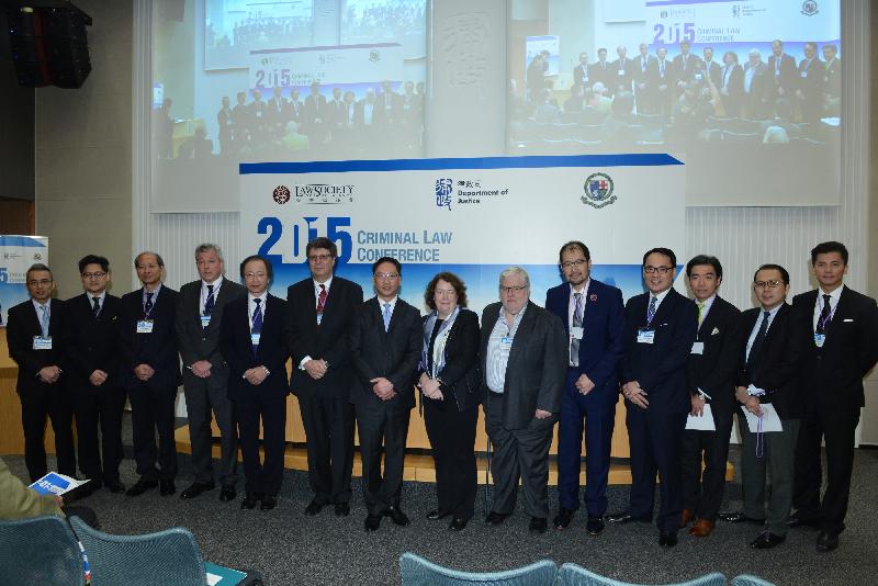 The Secretary for Justice, Mr Rimsky Yuen, SC, (left seven) and the Director of Public Prosecutions, Mr Keith Yeung, SC (left five), with the moderators and guests of the conference.