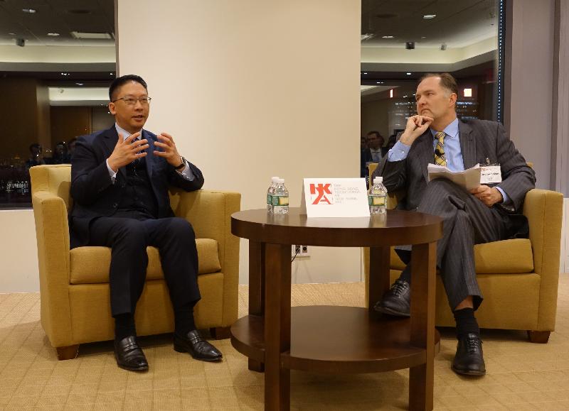 The Secretary for Justice, Mr Rimsky Yuen, SC, (left) speaks about Hong Kong's unique advantages in providing legal and dispute resolution services in the Asia-Pacific region at an event jointly hosted by the New York International Arbitration Center and Hong Kong Association of New York.