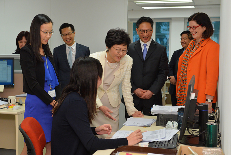 The Chief Secretary for Administration, Mrs Carrie Lam, visited the office building of the Department of Justice at Justice Place in Central this afternoon (August 4). Photo shows Mrs Lam (fourth right) visiting the Law Drafting Division in the company of the Secretary for Justice, Mr Rimsky Yuen, SC (third right); the Law Draftsman, Ms Theresa Johnson (first right); and the Director of Administration and Development, Mr Alan Siu (second right).