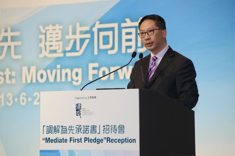 The Secretary for Justice, Mr Rimsky Yuen, SC, delivers a speech at the 'Mediate First' Pledge Reception today (June 13).