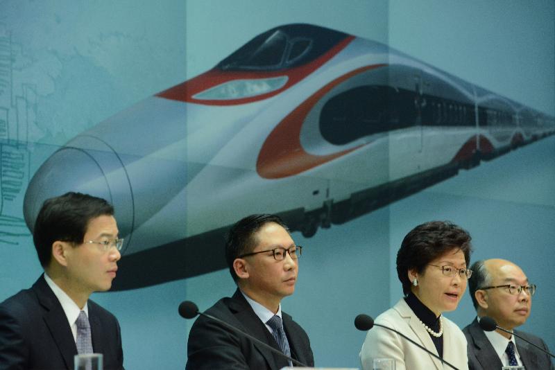 The Chief Executive, Mrs Carrie Lam (second right), held a press conference at the Central Government Offices today (December 27) on the decision of the Standing Committee of the National People's Congress on approving the Co-operation Arrangement between the Mainland and the Hong Kong Special Administrative Region on the Establishment of the Port at the West Kowloon Station of the Guangzhou-Shenzhen-Hong Kong Express Rail Link for Implementing Co-location Arrangement. Joining her at the press conference are the Secretary for Justice, Mr Rimsky Yuen, SC (second left); the Secretary for Transport and Housing, Mr Frank Chan Fan (first right); and the Acting Secretary for Security, Mr Sonny Au (first left).