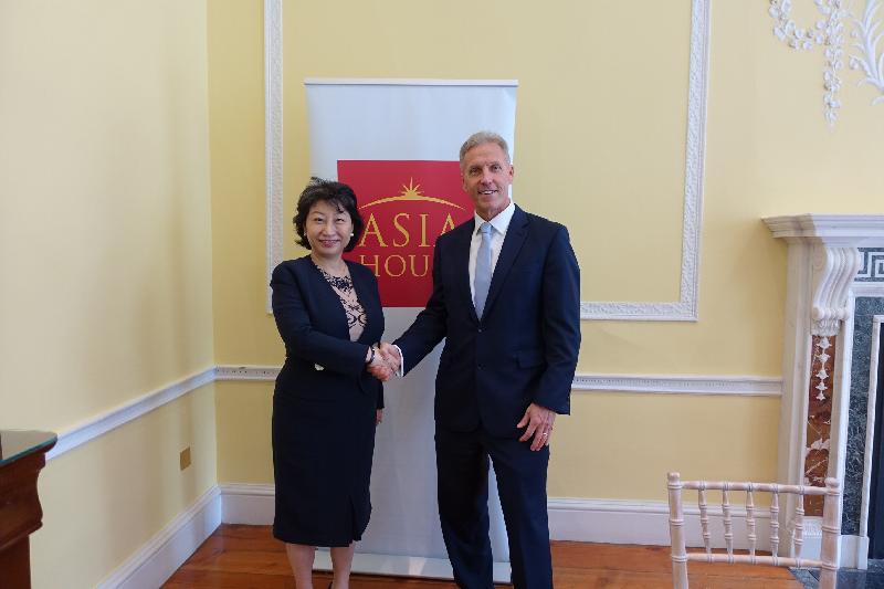 The Secretary for Justice, Ms Teresa Cheng, SC (left), meets with the Chief Executive of the Asia House, Mr Michael Lawrence (right) in London today (June 14, London time).