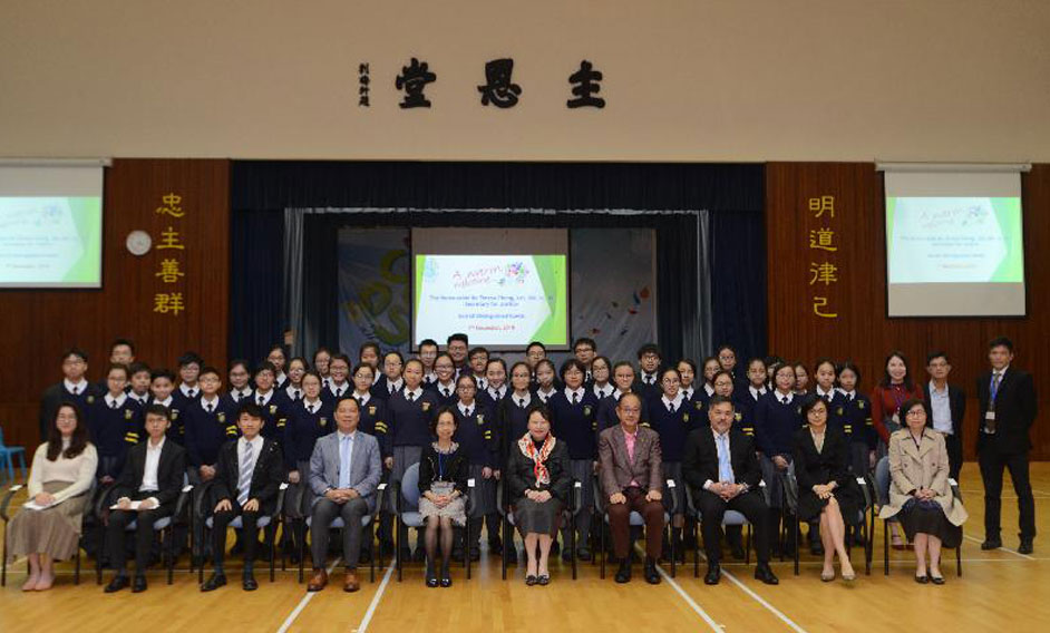 The Secretary for Justice, Ms Teresa Cheng, SC, visited Carmel Divine Grace Foundation Secondary School today (December 7). Photo shows Ms Cheng (front row, fifth right) with the Chairman of the Sai Kung District Council, Mr George Ng (front row, fourth right), and the District Officer (Sai Kung), Mr David Chiu (front row, third right), as well as teachers and students.
