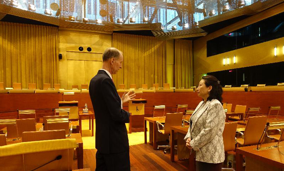 The Secretary for Justice, Ms Teresa Cheng, SC (right), accompanied by Judge Christopher Vajda (left), tours the Main Courtroom of the European Union Court of Justice in Luxembourg today (April 12, Luxembourg time).