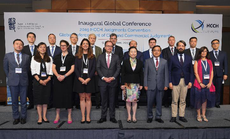 The Secretary for Justice, Ms Teresa Cheng, SC (front row, fourth right), is pictured with the Director-General of the Department of Treaty and Law of the Ministry of Foreign Affairs, Mr Jia Guide (front row, third right); the Secretary General of the Hague Conference on Private International Law (HCCH), Dr Christophe Bernasconi (front row, centre); and speakers at the “ 2019 HCCH Judgments Convention: Global Enforcement of Civil and Commercial Judgments ” today (September 9).