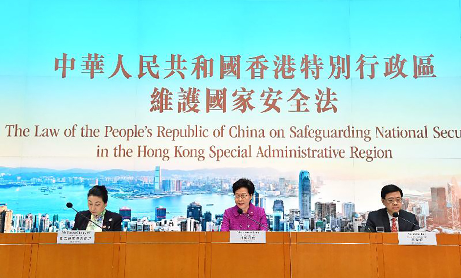 The Chief Executive, Mrs Carrie Lam (centre), together with the Secretary for Justice, Ms Teresa Cheng, SC (left) and the Secretary for Security, Mr John Lee (right), hold a press conference on The Law of the People's Republic of China on Safeguarding National Security in the Hong Kong Special Administrative Region at Central Government Offices, Tamar today (July 1) .