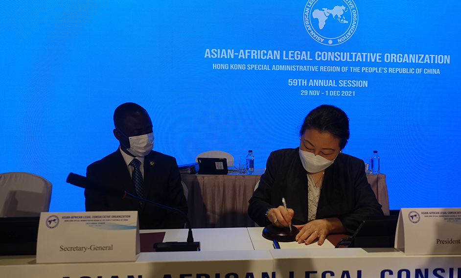 The 59th Annual Session of the Asian-African Legal Consultative Organization (AALCO) came to a close today (December 1). Photo shows the Secretary for Justice, Ms Teresa Cheng, SC (right), signing a sound block after the meeting. Looking on is the immediate past Secretary-General of AALCO, Professor Kennedy Gastorn (left).