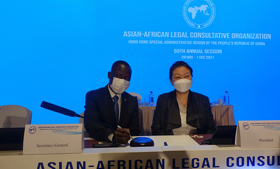 The 59th Annual Session of the Asian-African Legal Consultative Organization (AALCO) came to a close today (December 1). Photo shows the immediate past Secretary-General of AALCO, Professor Kennedy Gastorn (left), signing a sound block after the meeting. Looking on is the Secretary for Justice, Ms Teresa Cheng, SC (right).