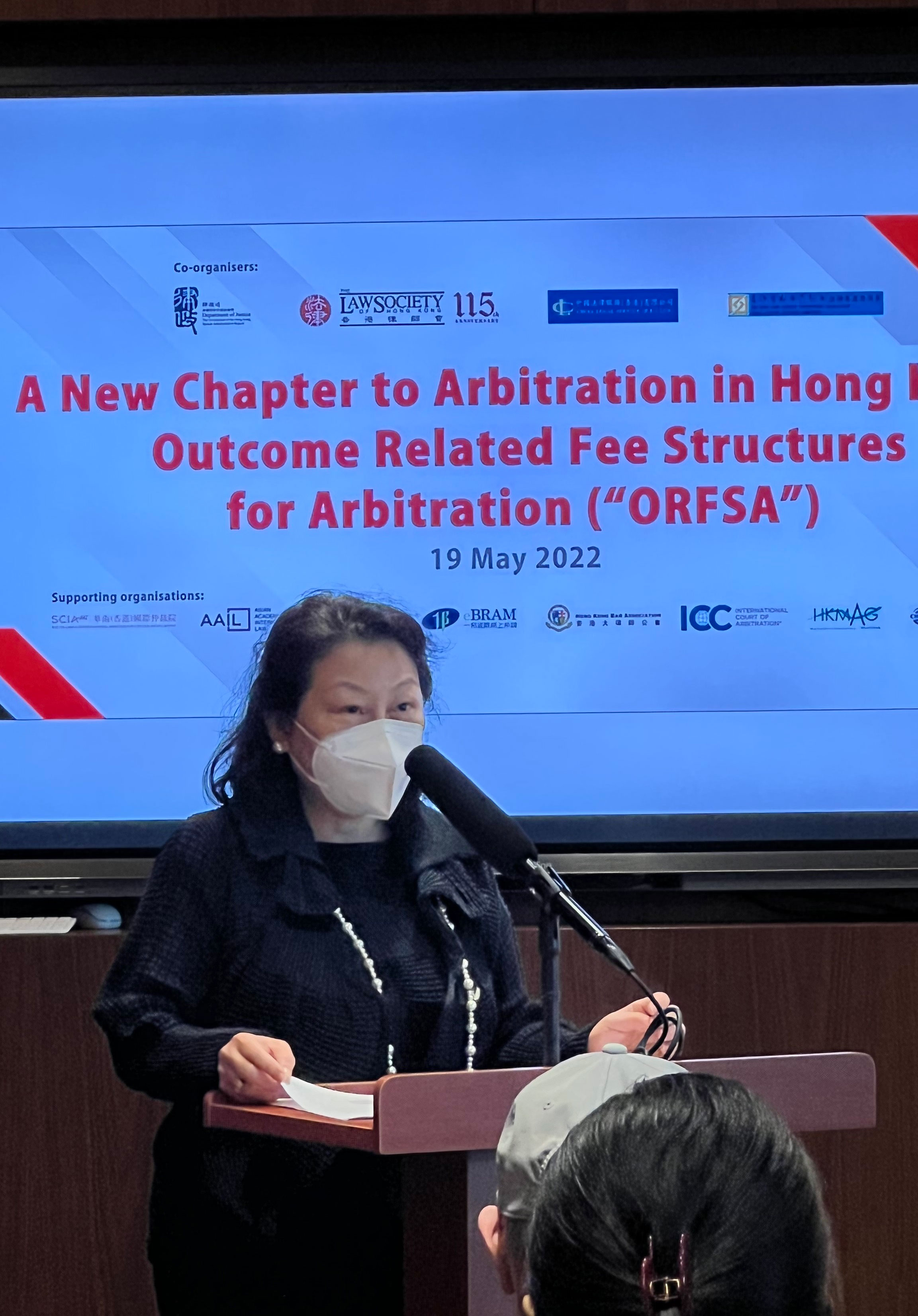 The Secretary for Justice, Ms Teresa Cheng, SC, speaks at the seminar entitled "A New Chapter to Arbitration in Hong Kong: Outcome Related Fee Structures for Arbitration" jointly organised by the Department of Justice, the In-House Lawyers Committee of the Law Society of Hong Kong, the Hong Kong Chinese Enterprises Association Legal Affairs Steering Committee and the China Legal Service (HK) today (May 19).