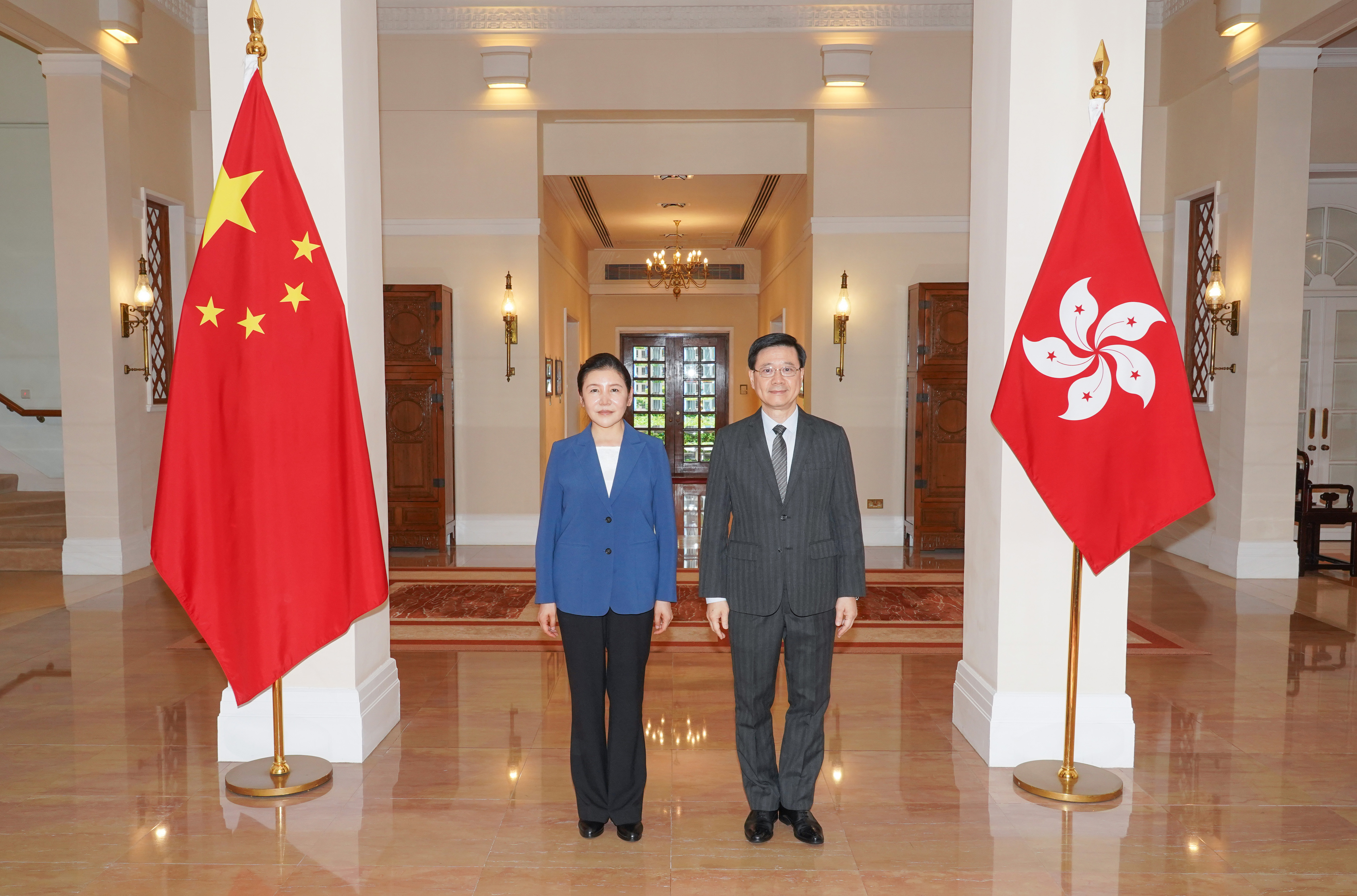 The Chief Executive, Mr John Lee, met the Minister of Justice, Ms He Rong, at Government House on July 17. Photo shows Mr Lee (right) and Ms He (left).
