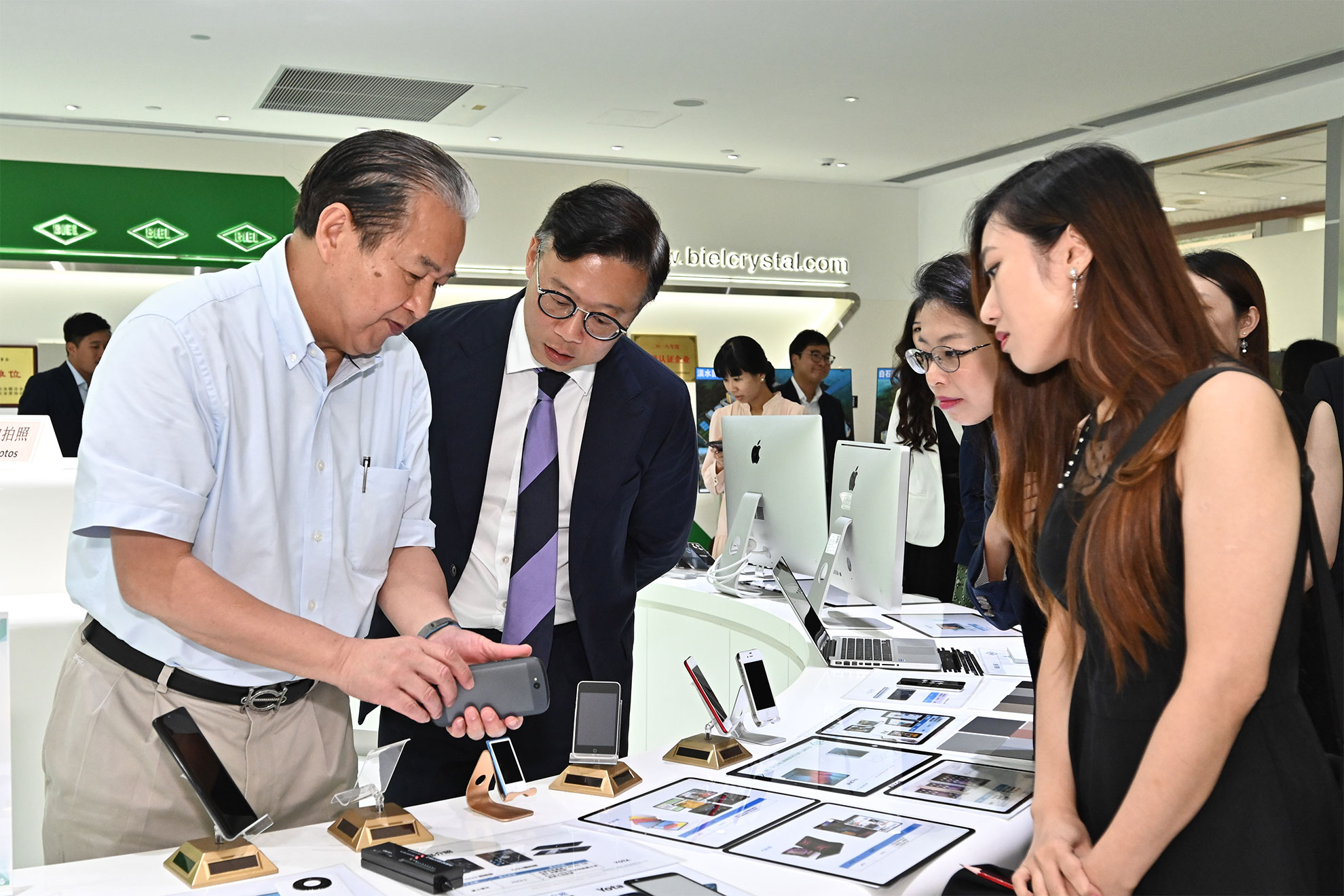 The Deputy Secretary for Justice, Mr Cheung Kwok-kwan, led a delegation comprising young lawyers and law students to visit Biel Crystal's Science and Technology Park in Huizhou today (September 7). Photo shows Mr Cheung (second left) and members of the delegation learning about the challenges of research and development of touch screen technology.